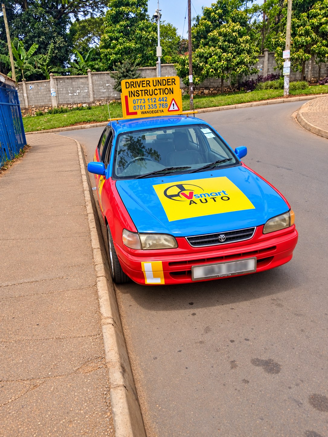 Front view of a VSMART training car with learner signage